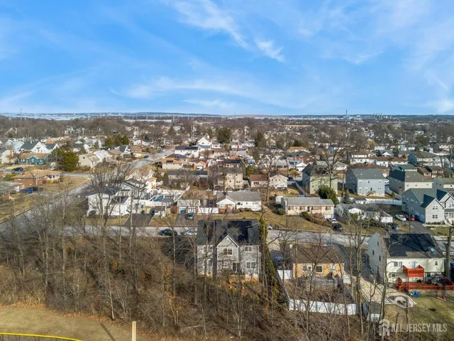 an aerial view of a residential houses with outdoor space