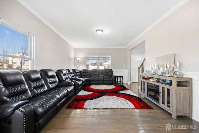 a living room with furniture fireplace and flat screen tv