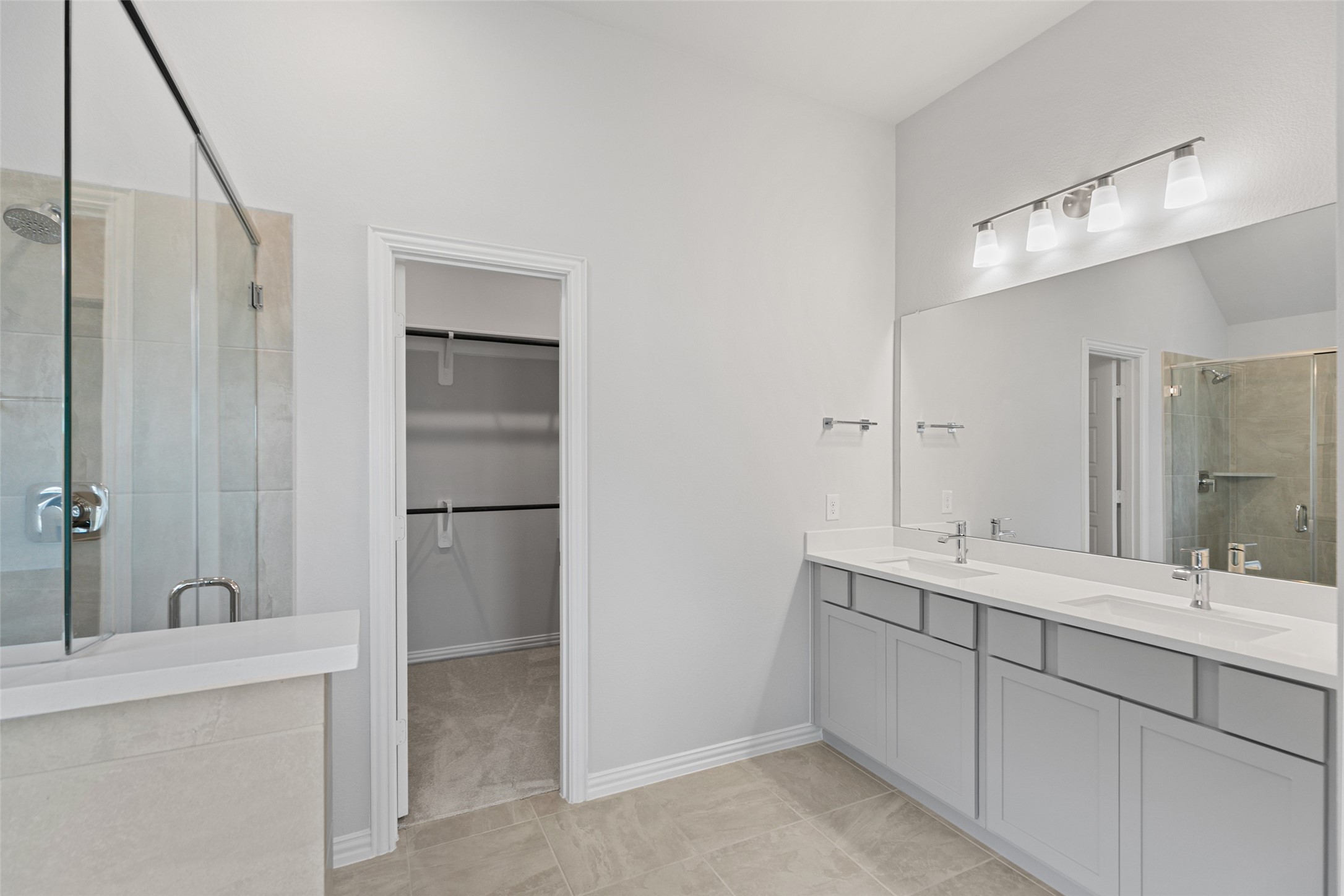 803 Evergreen Frst Lane Rosharon, TX 77583 - Photo 28 of 31 a bathroom with a double vanity sink and a mirror