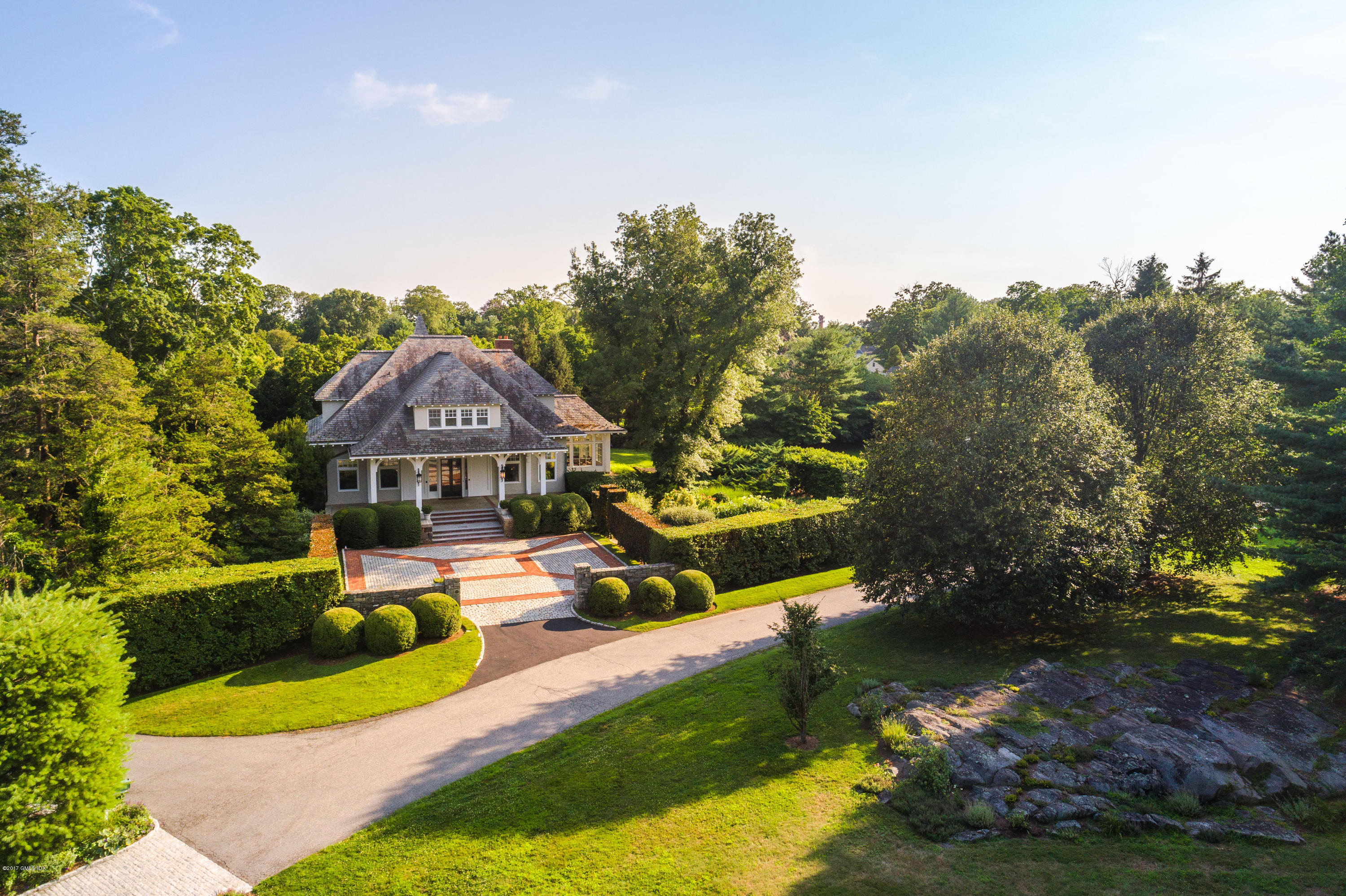 147 Byram Shore Road Greenwich, CT 06830 - Photo 1 of 19 a front view of a house with garden