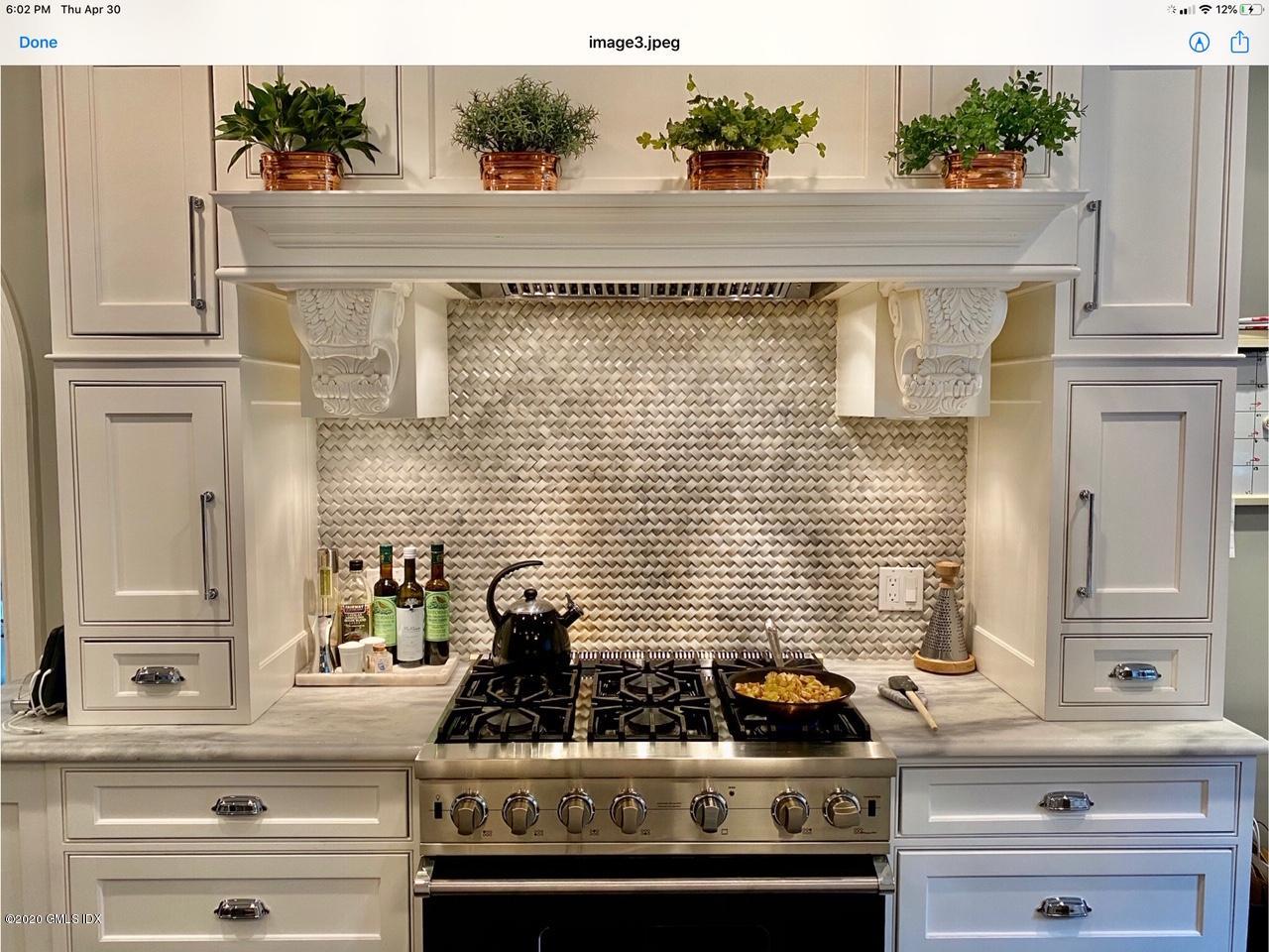 1 Club Road Riverside, CT 06878 - Photo 15 of 37 a kitchen with a stove and cabinets