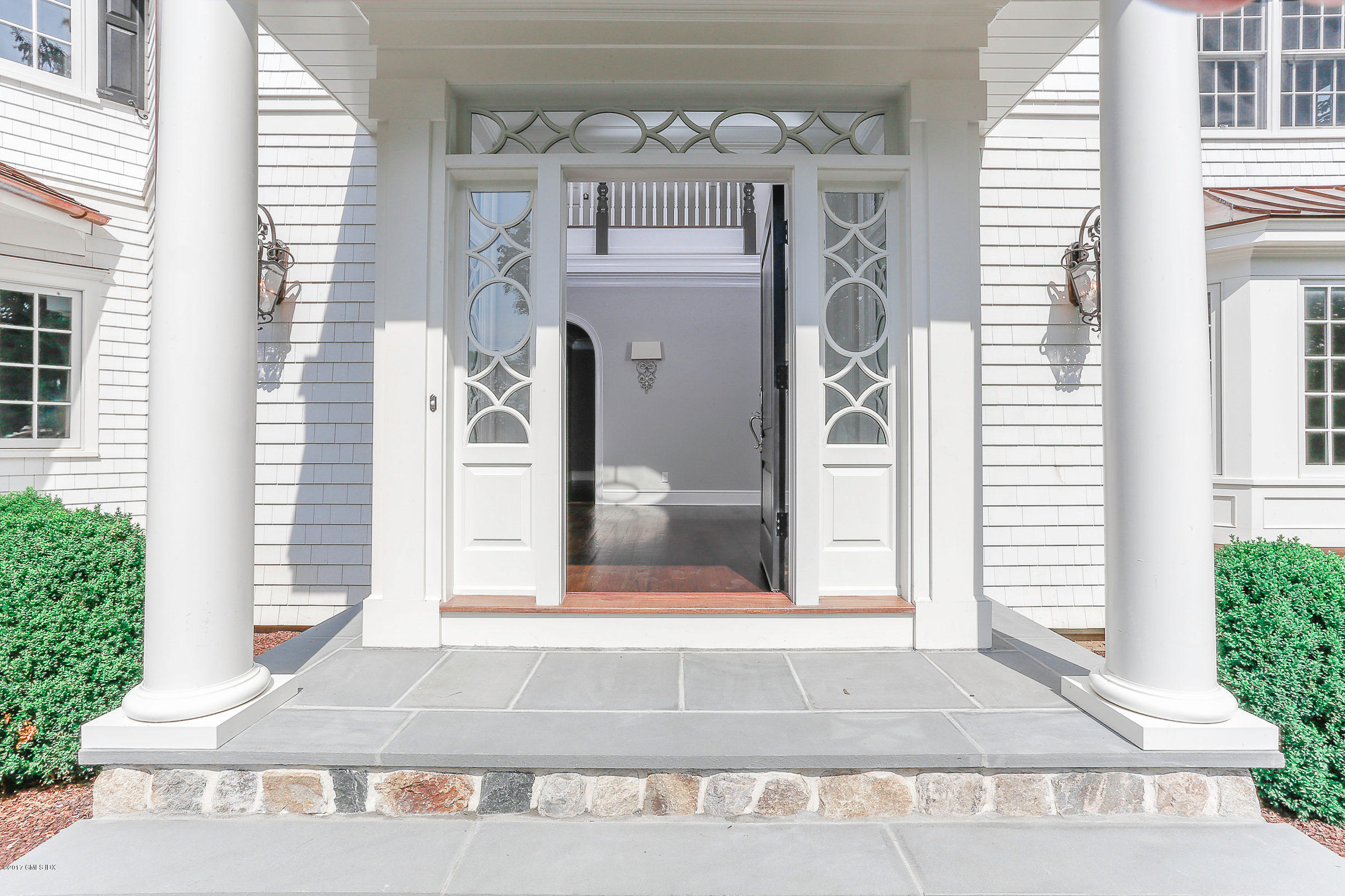 1 Club Road Riverside, CT 06878 - Photo 2 of 37 a front view of a house with a lots of windows