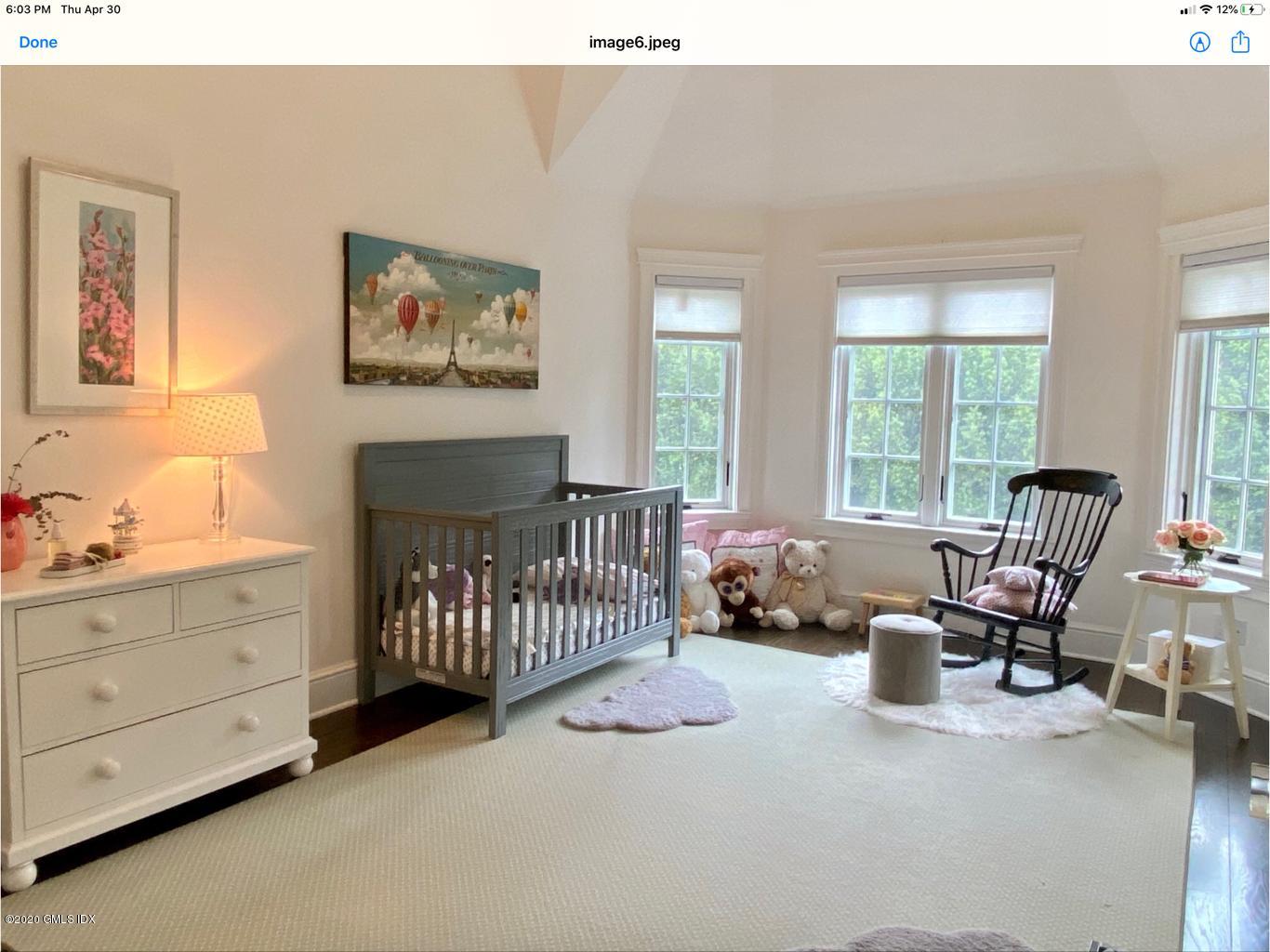 1 Club Road Riverside, CT 06878 - Photo 23 of 37 a bedroom with furniture and a window