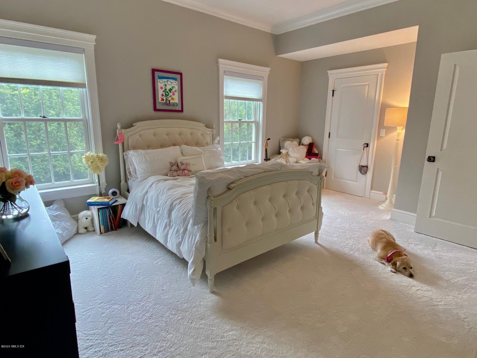 1 Club Road Riverside, CT 06878 - Photo 24 of 37 a bedroom with a bed and a window