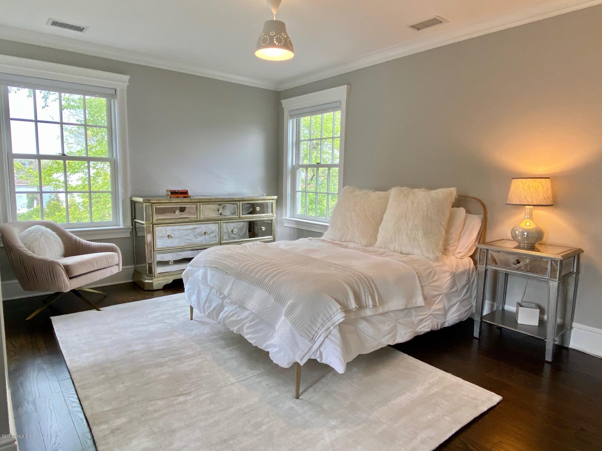 1 Club Road Riverside, CT 06878 - Photo 25 of 37 a bedroom with a bed chair and a window