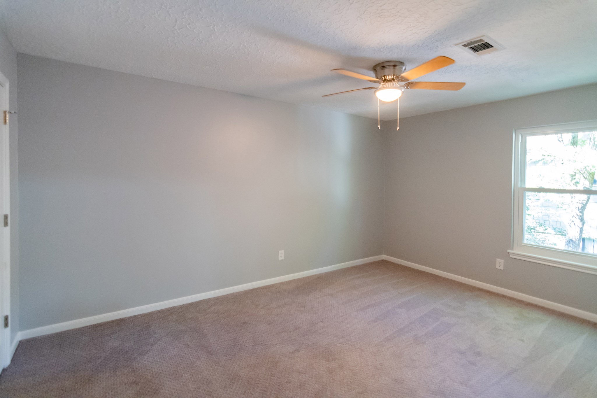 10 Coralvine Court Spring, TX 77380 - Photo 28 of 34 Bedroom 2 has fresh paint.