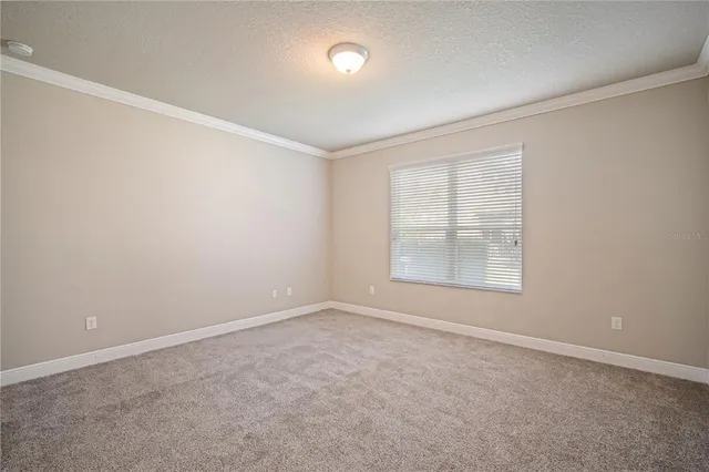 an empty room with a empty space and windows