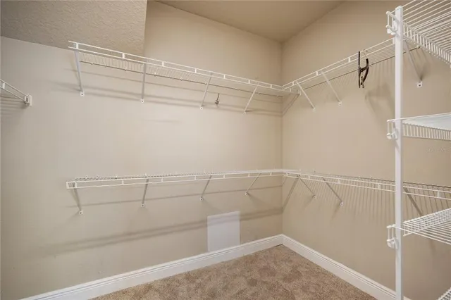 an empty room with a empty space and a window