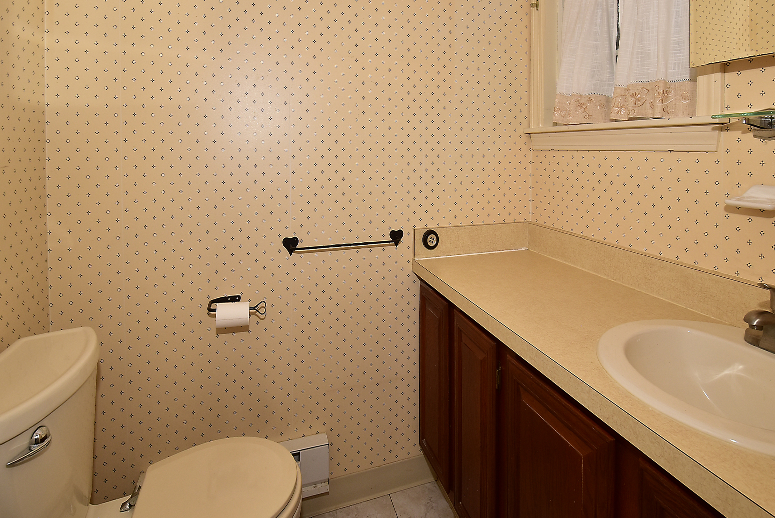 413 Lady Bug Lane, Unit 413 Vernon, CT 06066 - Photo 11 of 28 a bathroom with a sink and a toilet