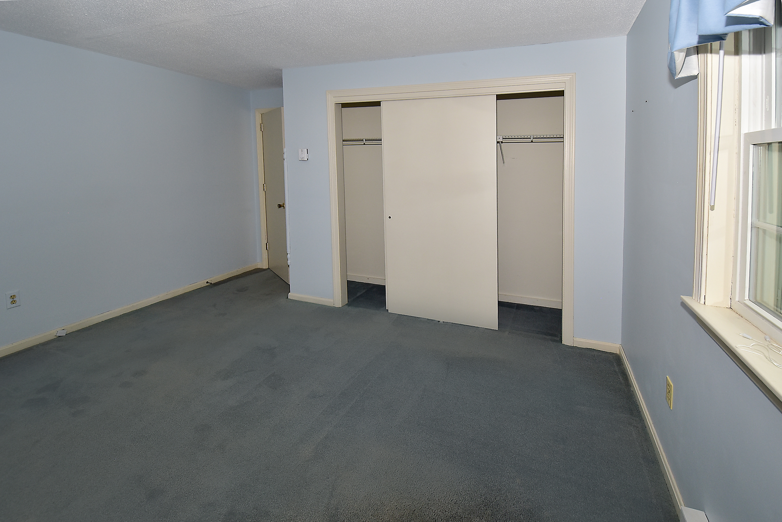 413 Lady Bug Lane, Unit 413 Vernon, CT 06066 - Photo 16 of 28 an empty room with windows