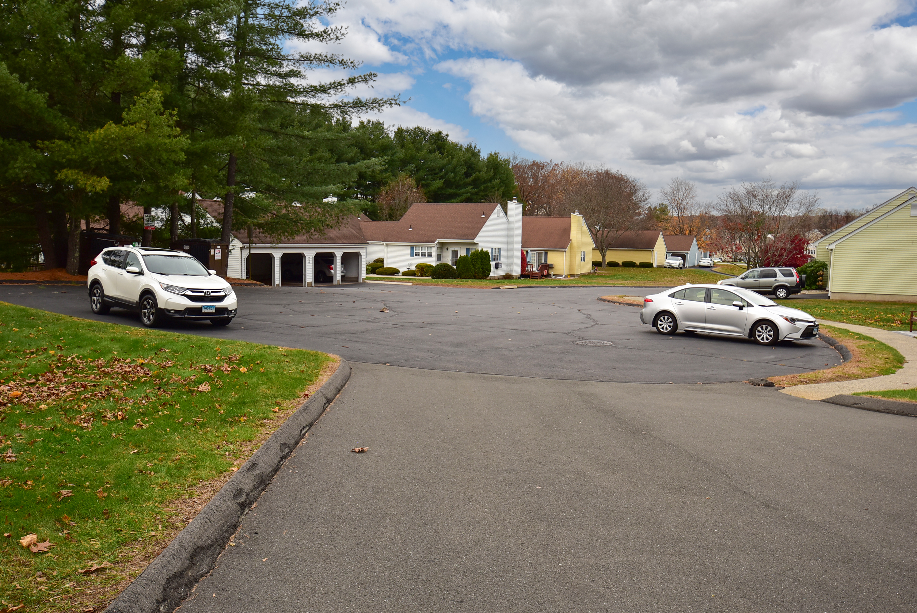 413 Lady Bug Lane, Unit 413 Vernon, CT 06066 - Photo 2 of 28 a car parked in front of white house
