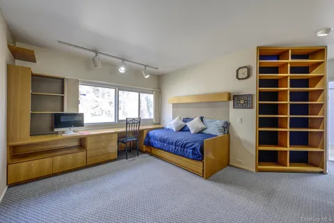 a bed room with a bed and a window