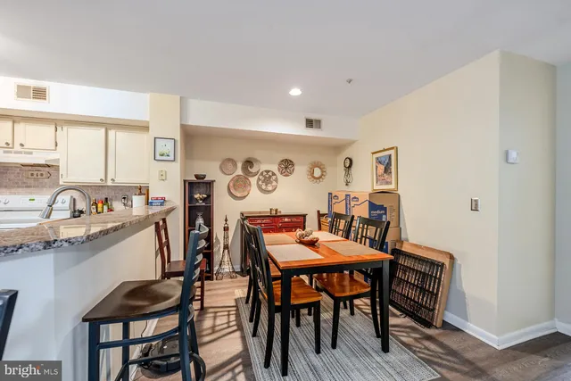 a view of a livingroom with furniture and a window