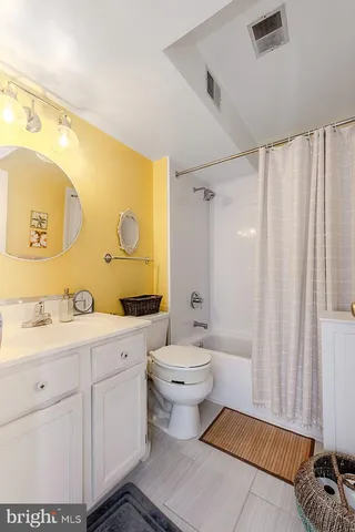 a view of a hallway with workspace and a mirror