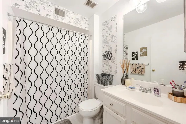 a view of a workspace with furniture and a bedroom