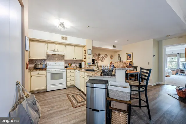 a kitchen with counter top space and cabinets