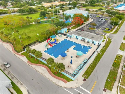 an aerial view of residential houses with outdoor space
