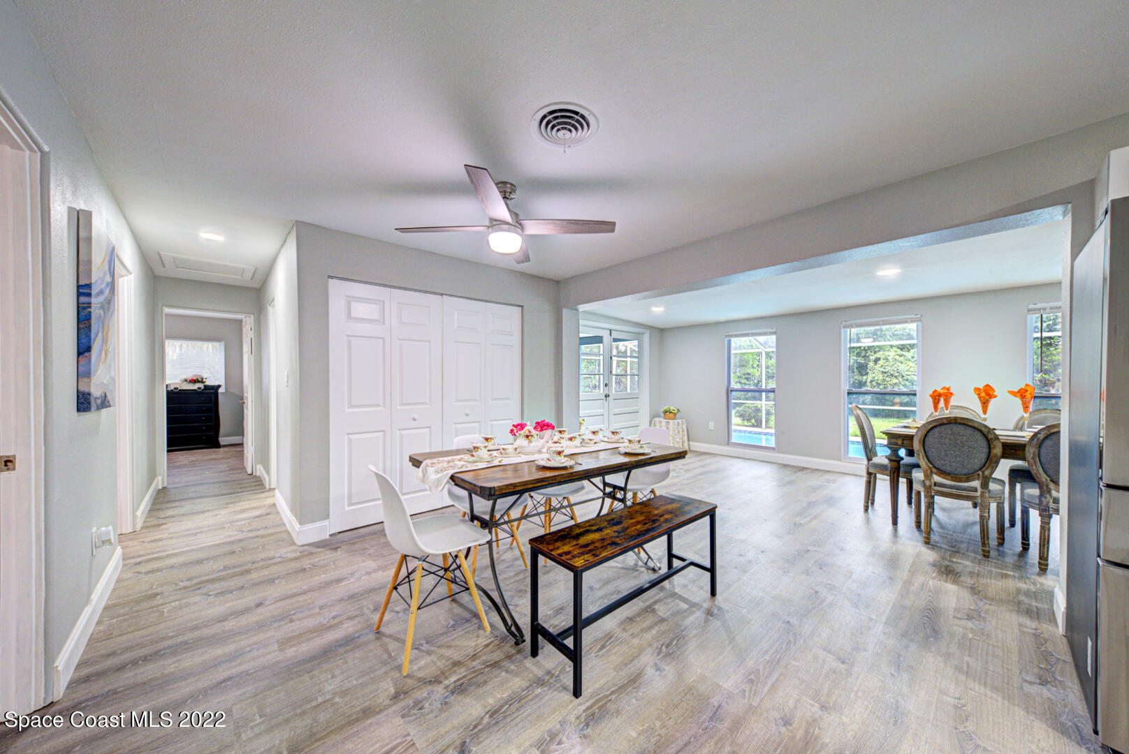 758 Buffalo Road Titusville, FL 32796 - Photo 13 of 52 a living room with furniture and a wooden floor