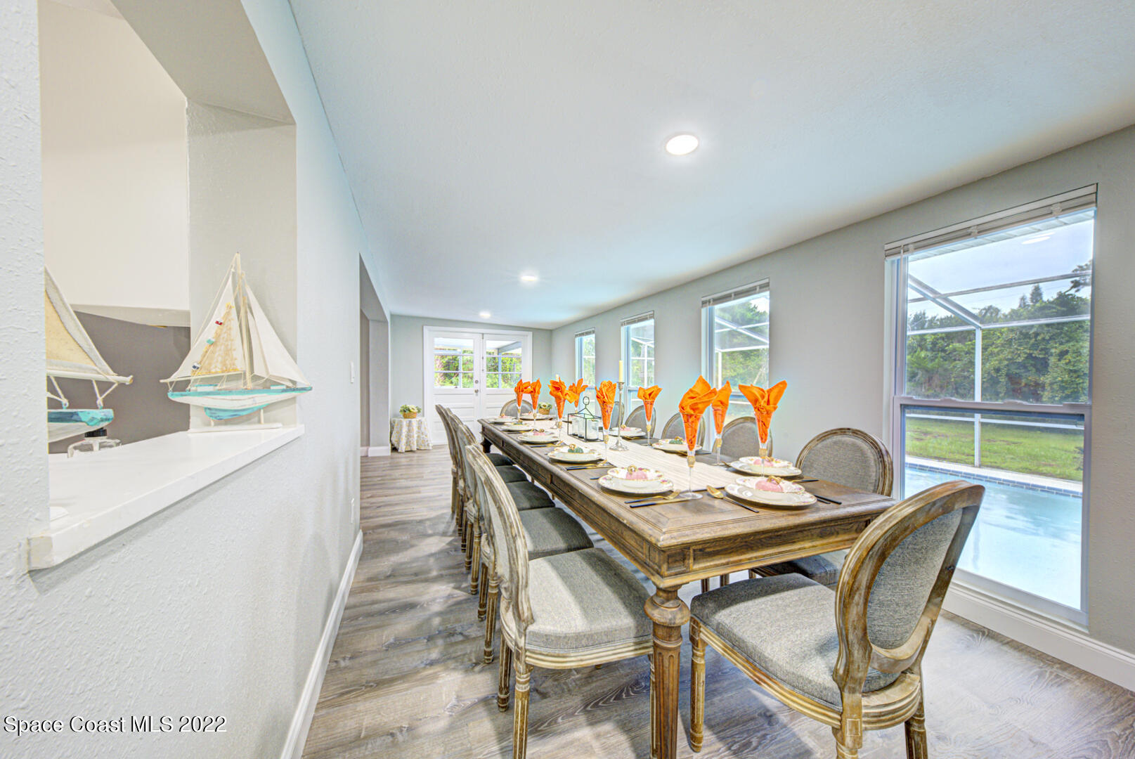 758 Buffalo Road Titusville, FL 32796 - Photo 14 of 52 a dining room with furniture and a large window