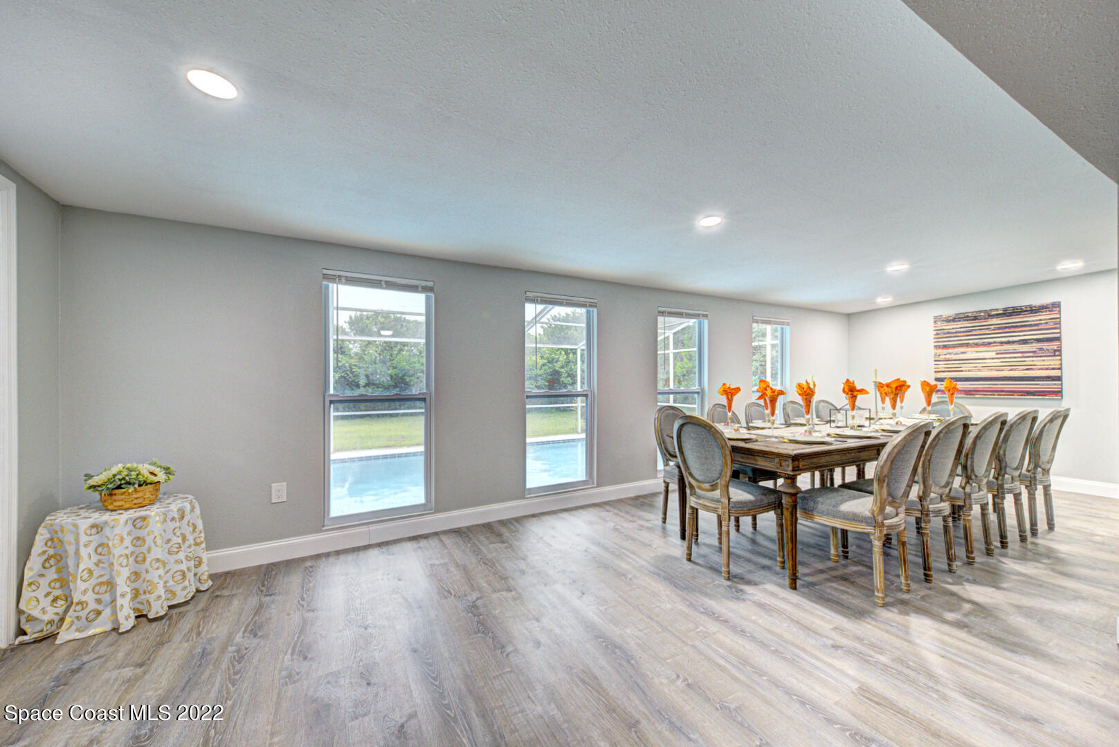 758 Buffalo Road Titusville, FL 32796 - Photo 15 of 52 a view of a dining room with furniture and wooden floor
