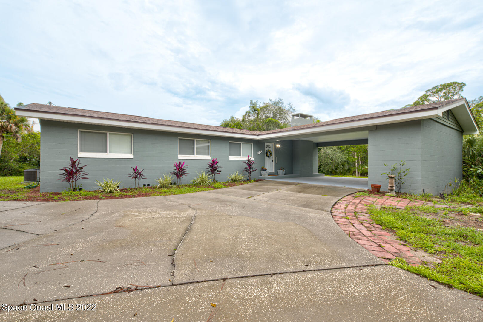 758 Buffalo Road Titusville, FL 32796 - Photo 2 of 52 a front view of house with yard