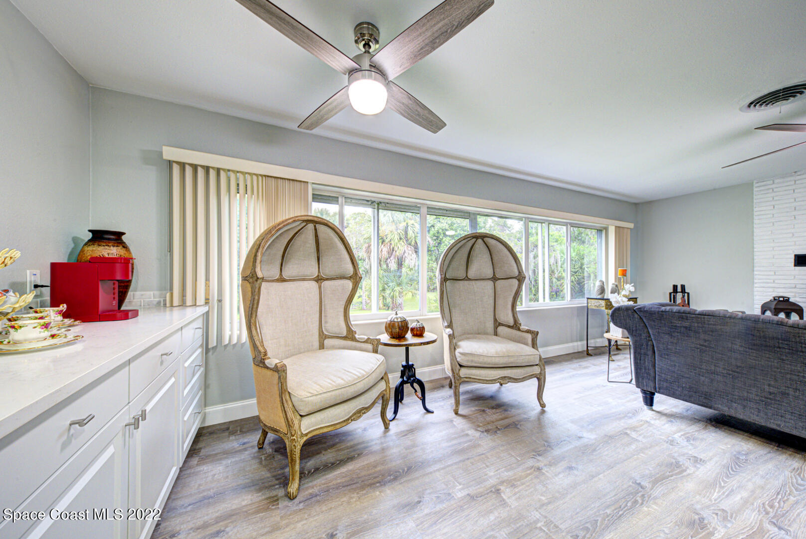 758 Buffalo Road Titusville, FL 32796 - Photo 21 of 52 a living room with furniture and a large window