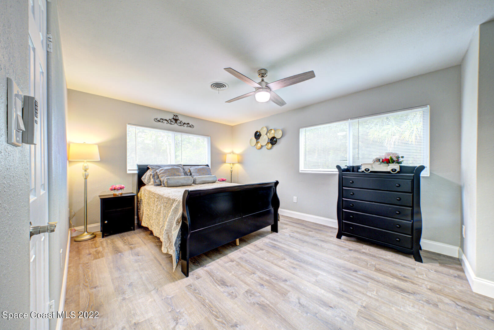 758 Buffalo Road Titusville, FL 32796 - Photo 24 of 52 a living room with furniture and a dresser
