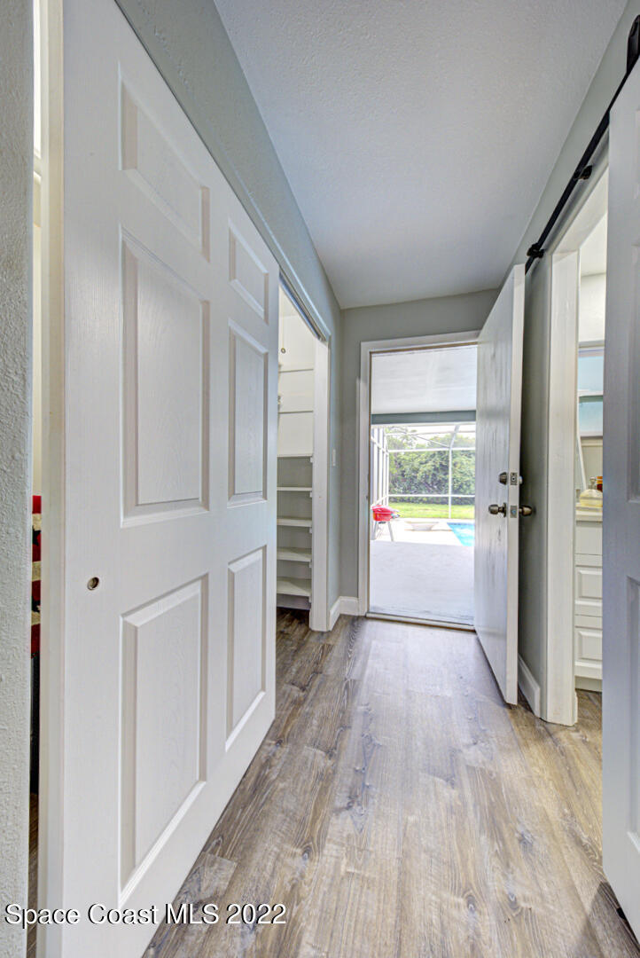 758 Buffalo Road Titusville, FL 32796 - Photo 26 of 52 a view of a hallway with an empty room and an empty room