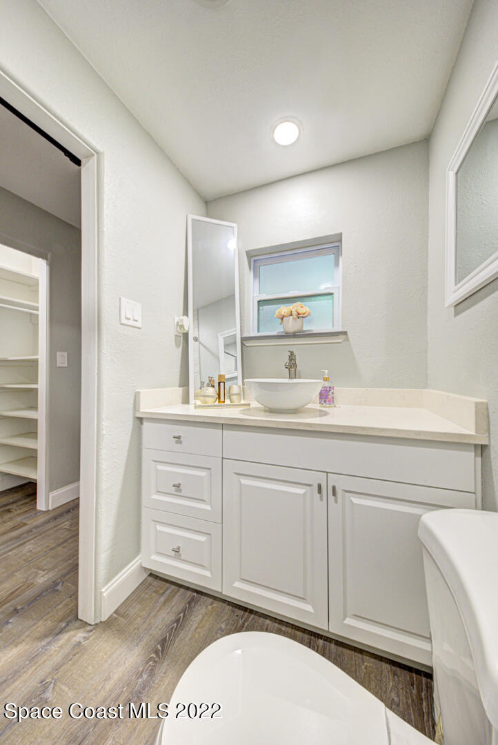 758 Buffalo Road Titusville, FL 32796 - Photo 28 of 52 a bathroom with a sink a vanity and a mirror
