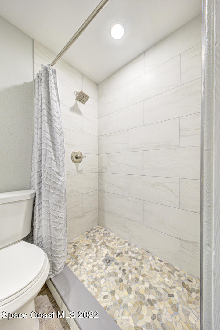 758 Buffalo Road Titusville, FL 32796 - Photo 30 of 52 a bathroom with a toilet and shower