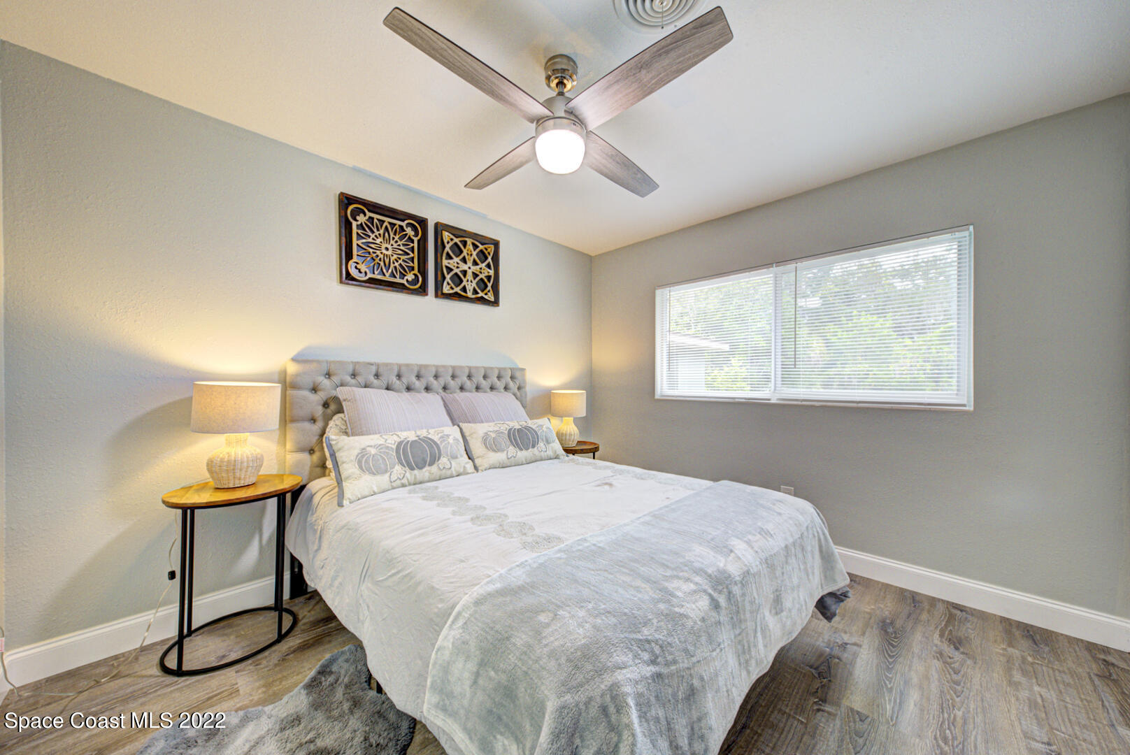 758 Buffalo Road Titusville, FL 32796 - Photo 31 of 52 a bedroom with a bed and a window