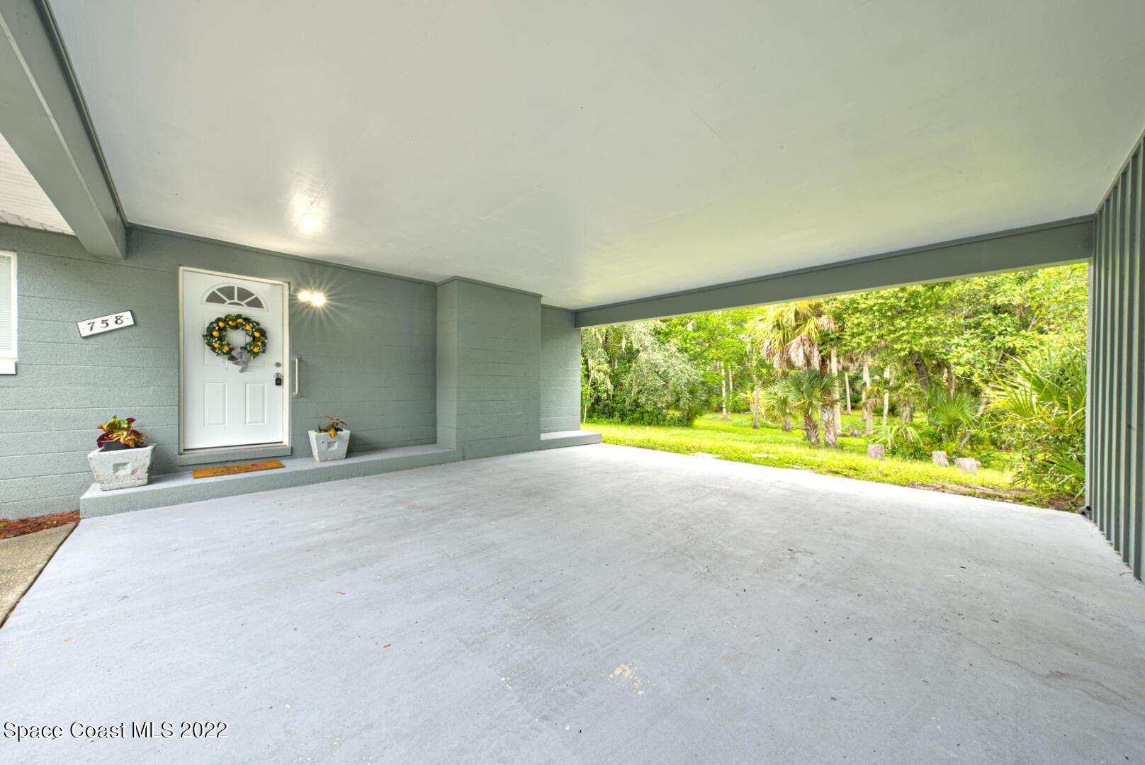 758 Buffalo Road Titusville, FL 32796 - Photo 38 of 52 a view of an empty room with a window
