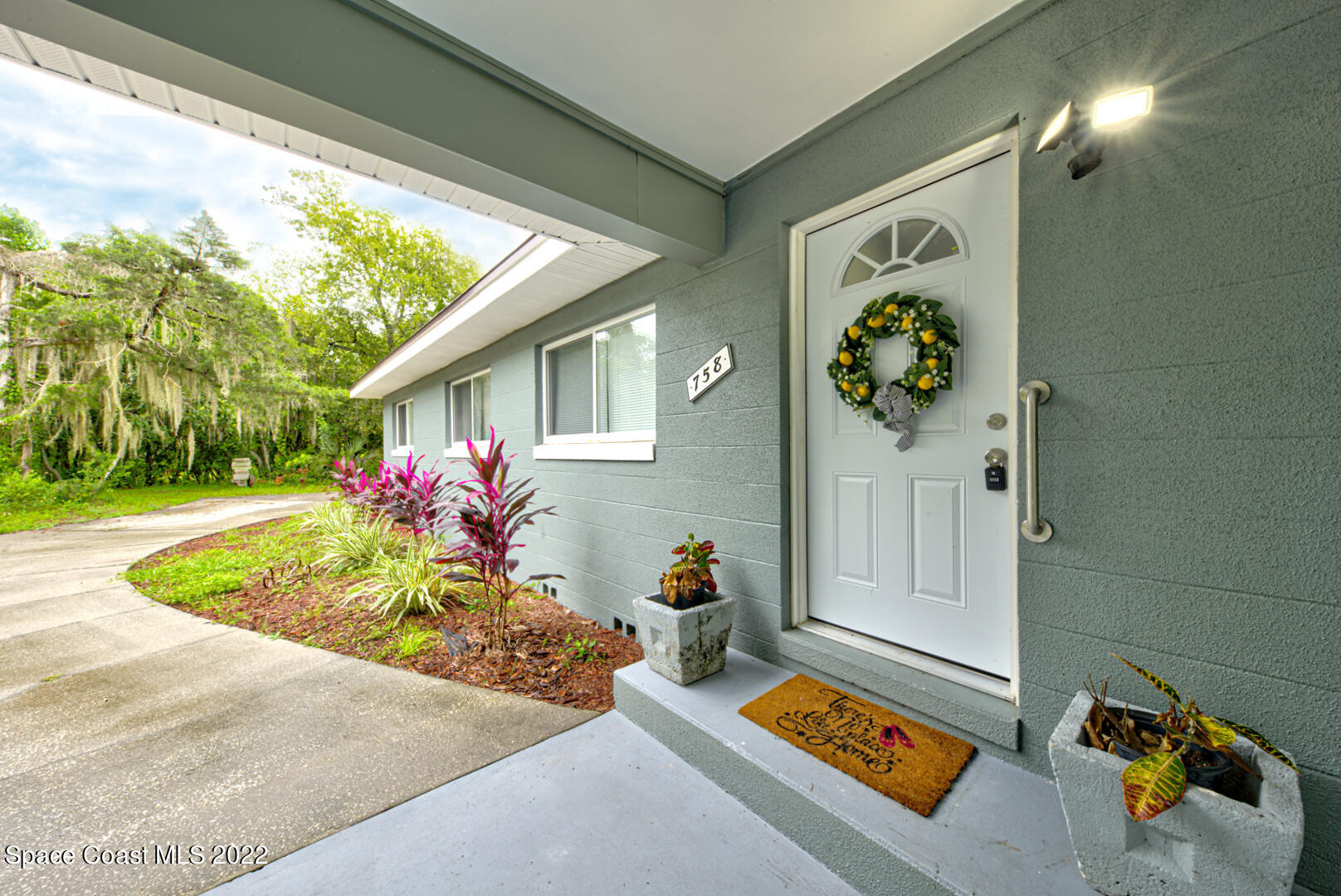 758 Buffalo Road Titusville, FL 32796 - Photo 4 of 52 a front view of a house with a yard