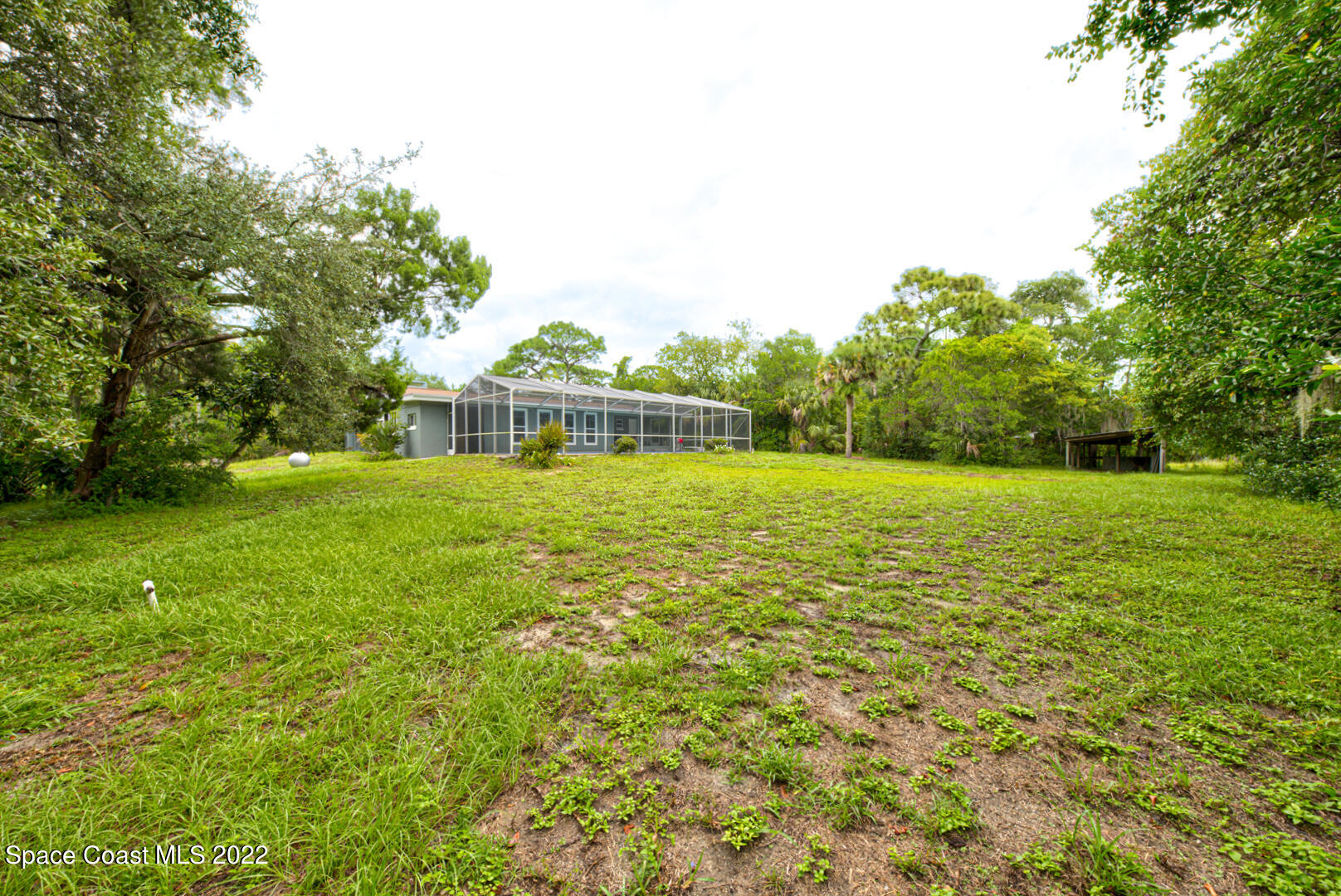 758 Buffalo Road Titusville, FL 32796 - Photo 45 of 52 a view of a house with a big yard