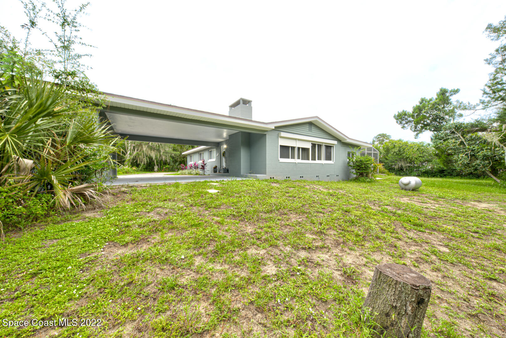 758 Buffalo Road Titusville, FL 32796 - Photo 49 of 52 a front view of house with yard and green space