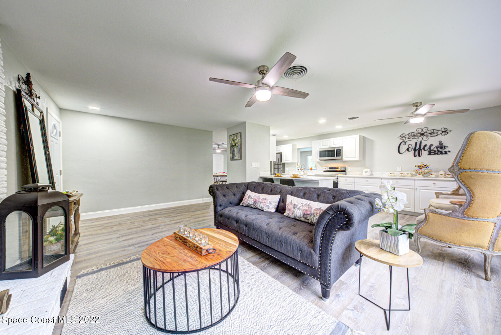 758 Buffalo Road Titusville, FL 32796 - Photo 6 of 52 a living room with furniture a rug and a window