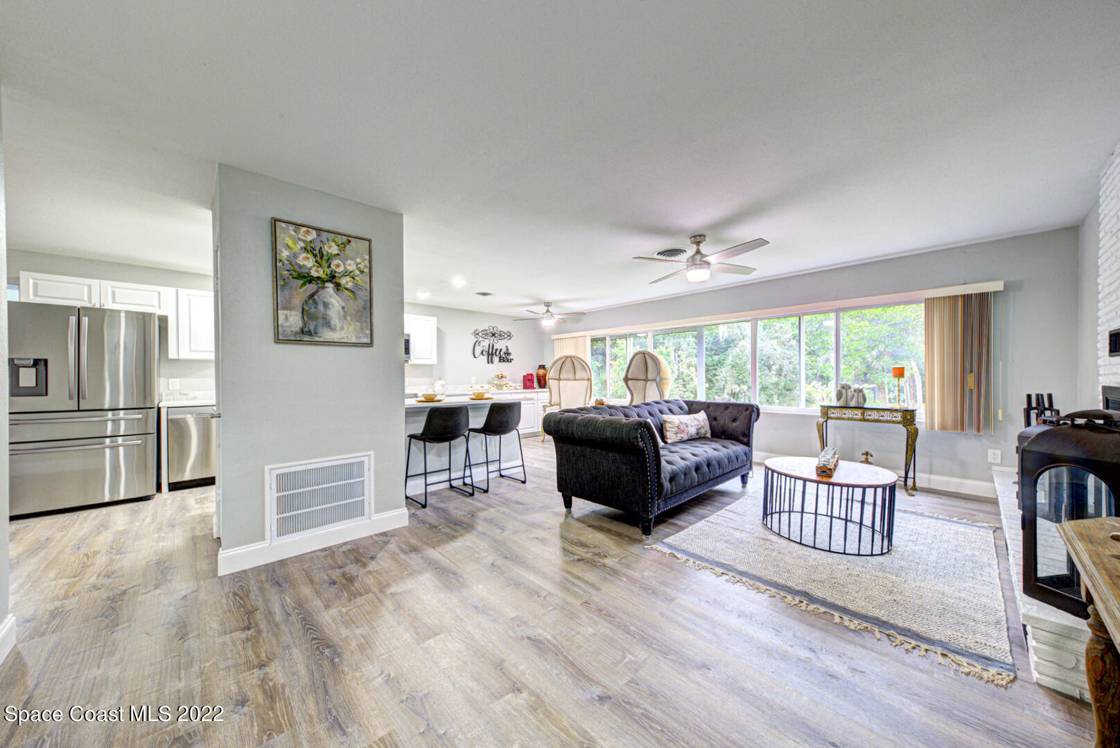 758 Buffalo Road Titusville, FL 32796 - Photo 7 of 52 a living room with furniture and a large window