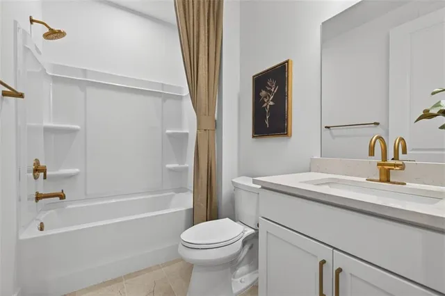 a bathroom with a sink a toilet and a bathtub