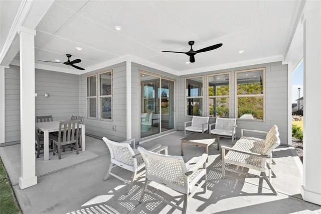 a dining room with furniture window and outside view