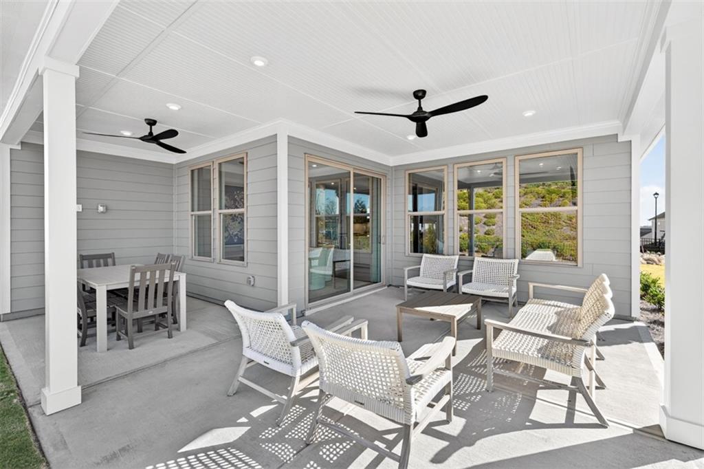 5425 Cordina Road Hoschton, GA 30548 - Photo 22 of 30 a dining room with furniture window and outside view
