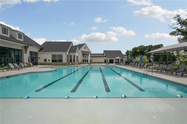 a view of a backyard with sitting area