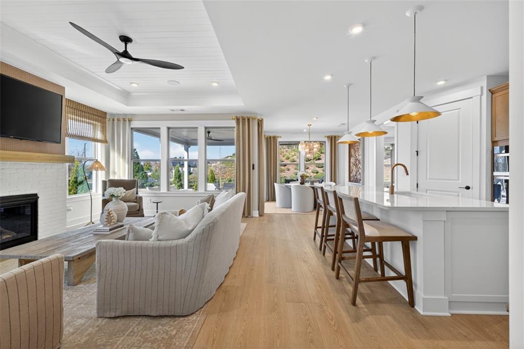 5425 Cordina Road Hoschton, GA 30548 - Photo 4 of 30 a living room with furniture and a fireplace