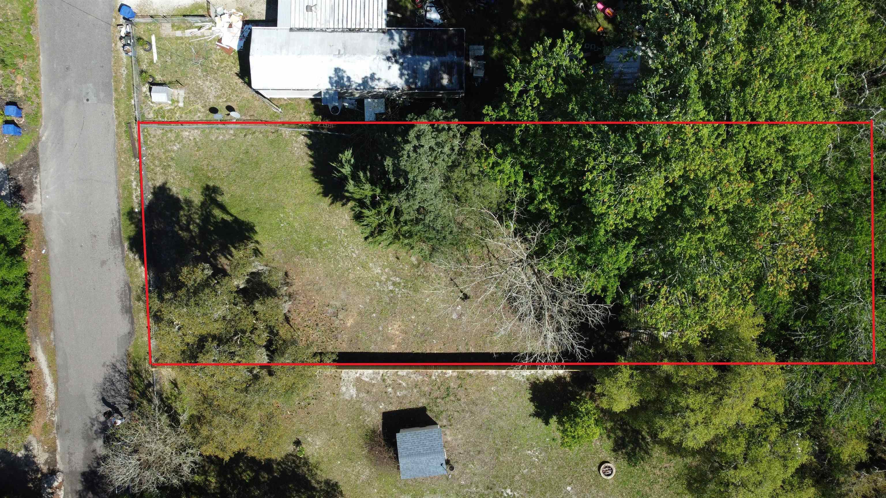 0 Schaller Road St. Augustine, FL 32084 - Photo 1 of 2 an aerial view of a houses with a yard and lake view