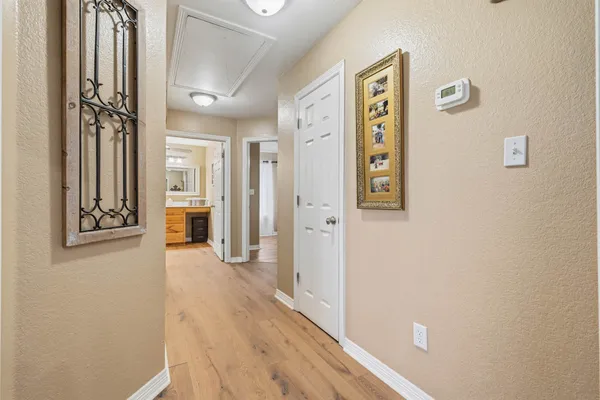 a spacious bathroom with a granite countertop sink mirror and a