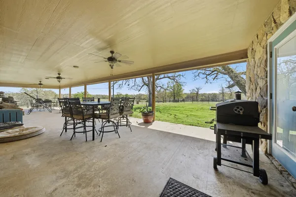 an aerial view of a city with lots of residential buildings and ocean view in back