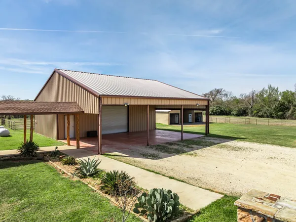 a hallway with front door wooden floor and windows