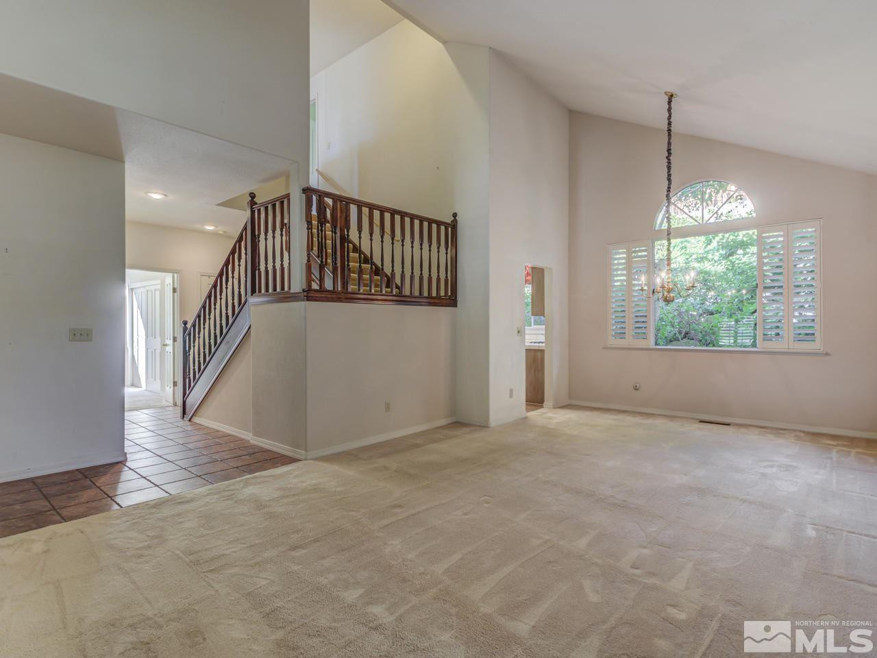 2989 Regal Court Reno, NV 89503 - Photo 3 of 13 a view of an empty room with wooden floor and windows