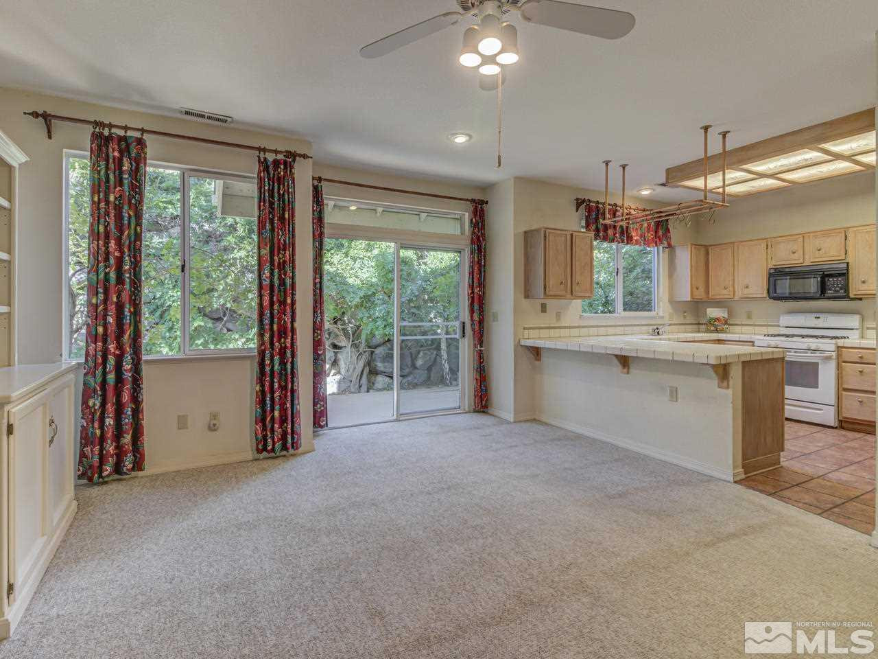 2989 Regal Court Reno, NV 89503 - Photo 5 of 13 a view of a kitchen with furniture and large windows
