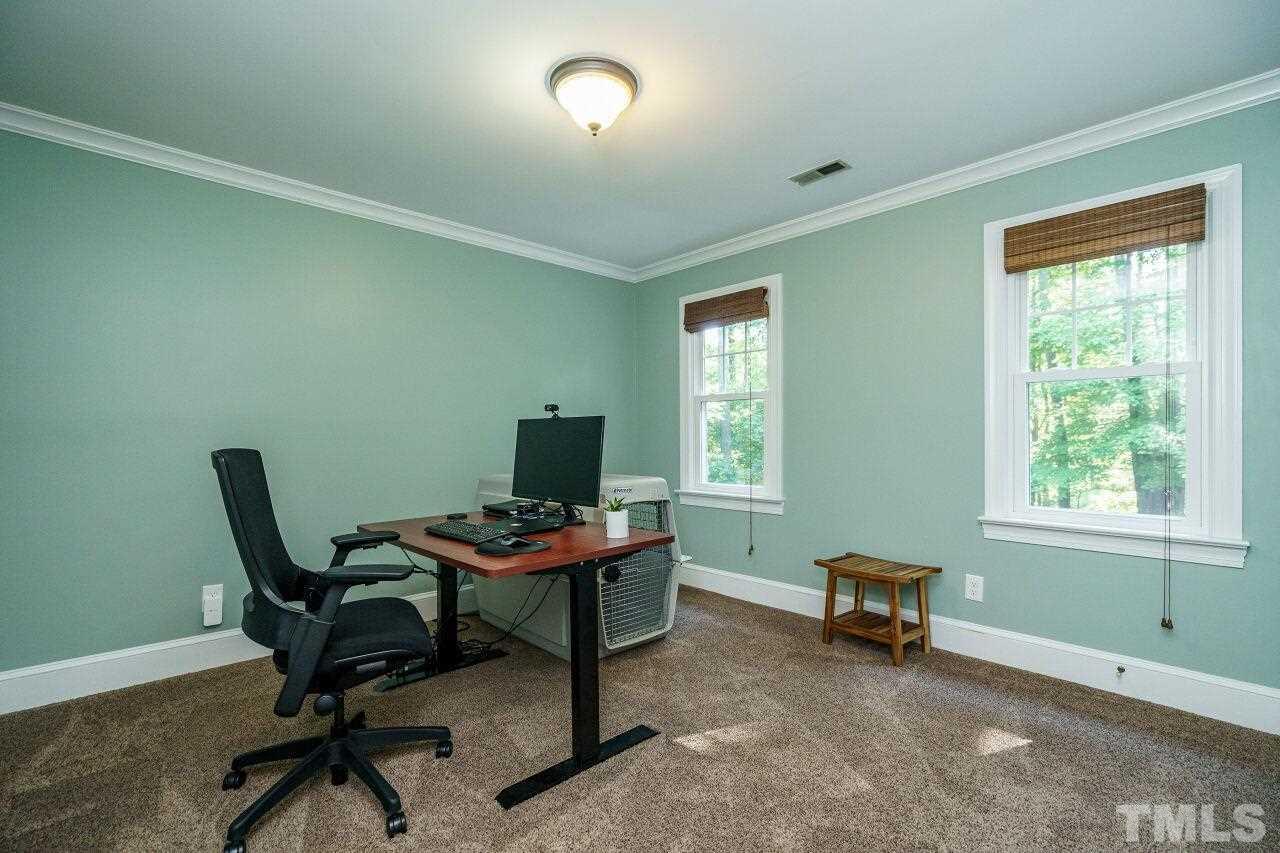 11000 Coachmans Way Raleigh, NC 27614 - Photo 21 of 30 Bedroom with ceiling crown and carpet floors.