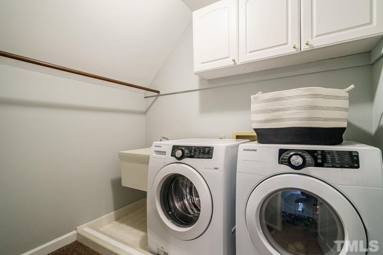 11000 Coachmans Way Raleigh, NC 27614 - Photo 24 of 30 Laundry Room with cabinets, sink and tile drain curb for appliances.